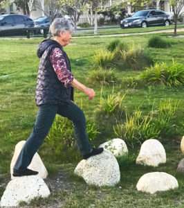 Joyce moves walking on large rocks