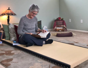 Joyce sitting on tatami sleeping mat