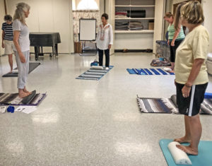 Lora teaching calf stretch