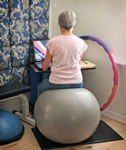 Joan coaching while sitting on Big Ball