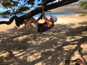 Joan climbing a tree at 83